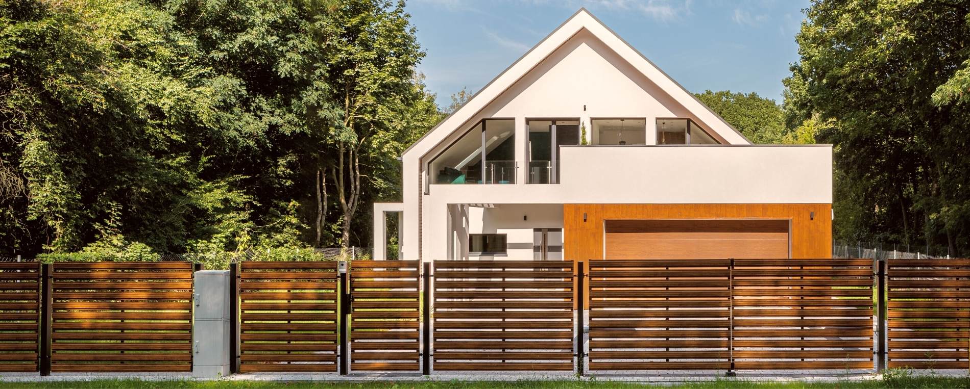 A modern house with a wooden fence